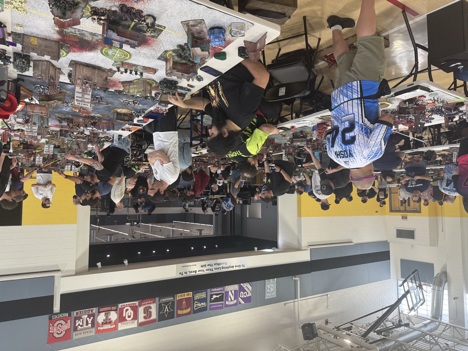 Players compete across a busy tournament floor at Scorched Earth Open 2026