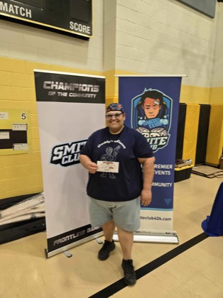 Ethmundo Rosales poses with a Best Display award at Scorched Earth Open 2026