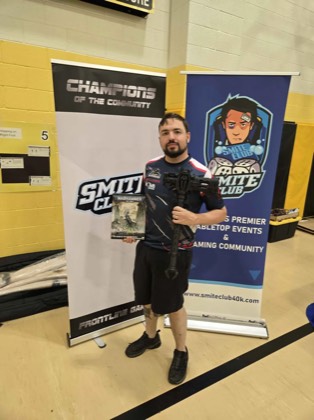 Ben Jurek holds the Best General hammer trophy at Scorched Earth Open 2026