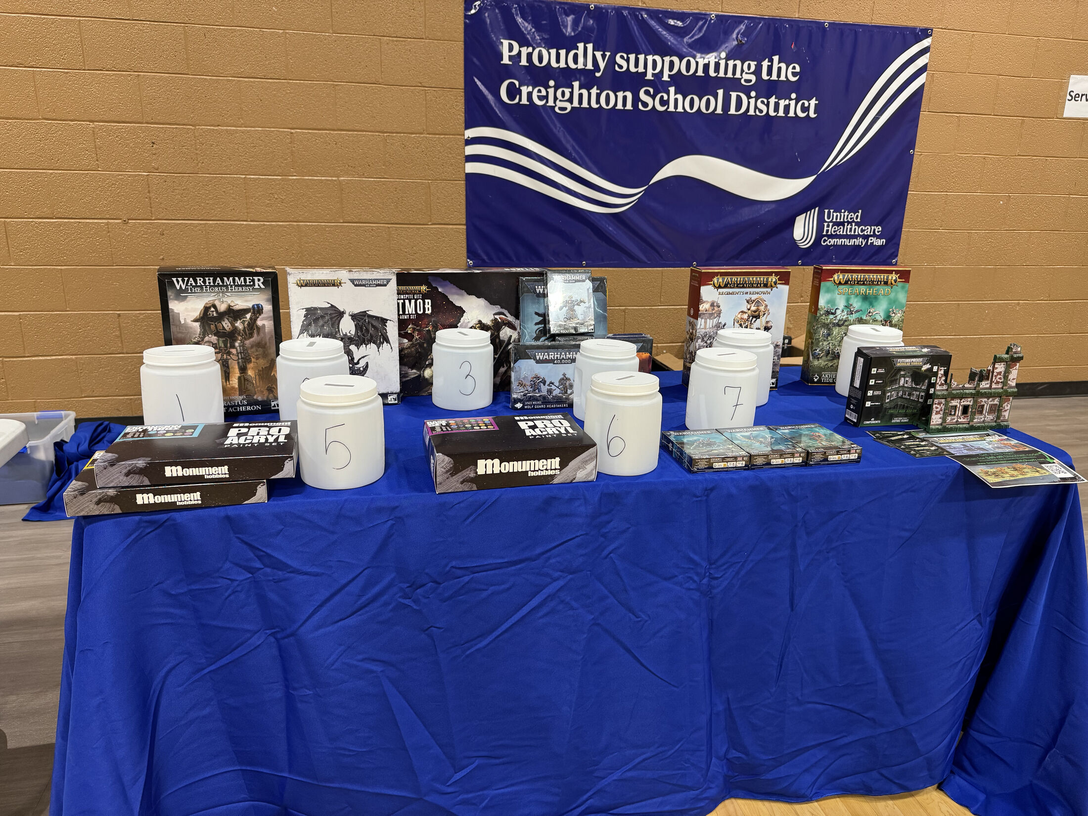 Raffle prizes beneath a UnitedHealthcare banner supporting Creighton School District